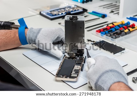 Close-up photos showing process of mobile phone repair