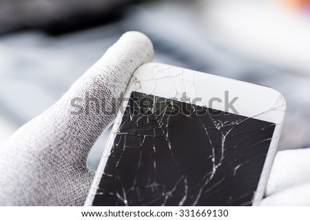 Close-up photo of a broken smartphone.