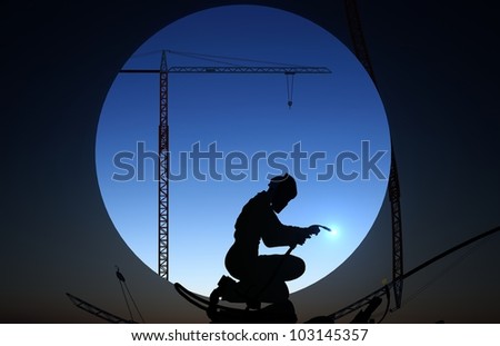 A silhouette of a worker-welder.