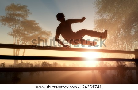 Silhouette of men jumping over the fence.