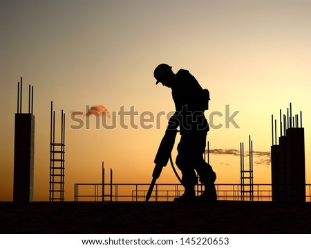 Silhouette of a worker on a background sky