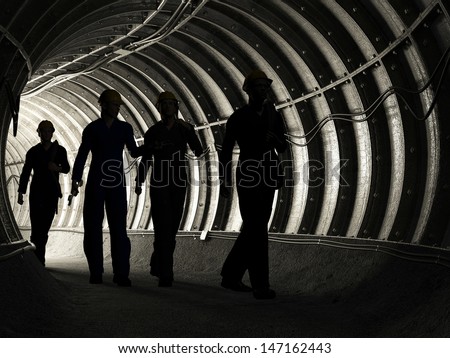 Silhouette of workers in mine