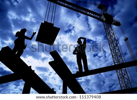 The Group Of Workers Working At A Construction Site.