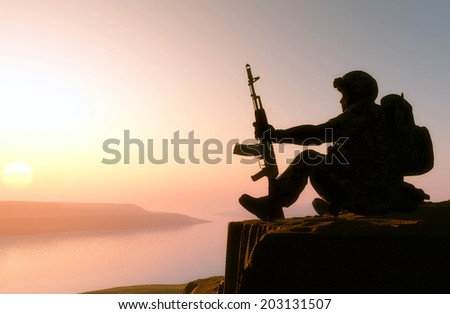 Silhouette of a soldier against the sun.