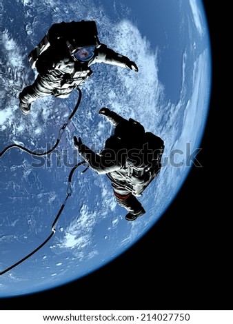 Two astronauts in space on the backdrop of the planet..\