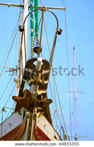 Rigging the yacht against the sky.