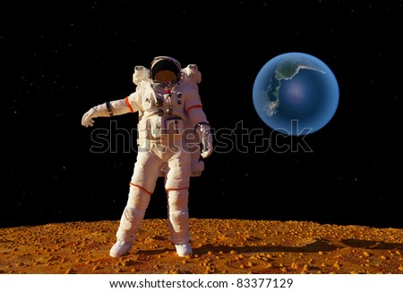 The astronaut  on the background of the planet.