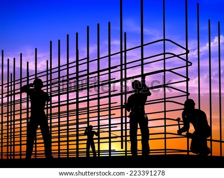 Silhouette of the workers on a background of the sky