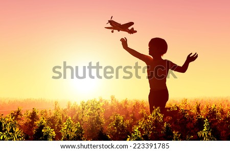 Boy starts plane and the sky.