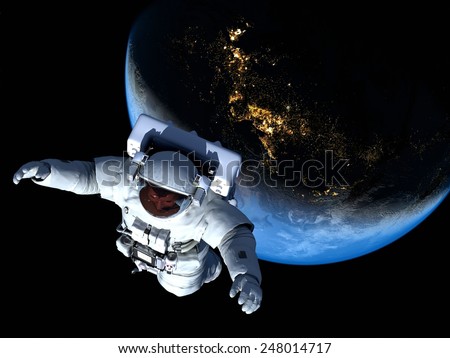 Astronaut in space above the clouds of the Earth..