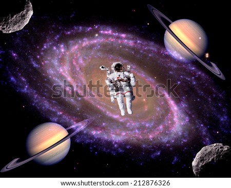 Astronaut spaceman spiral galaxy stars universe background. Elements of this image furnished by NASA.