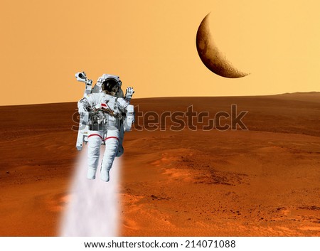 Astronaut planet Mars landscape surface. Elements of this image furnished by NASA.
