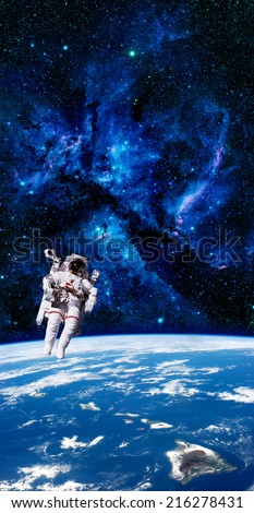 Astronaut spaceman aerial space stars Earth. Elements of this image furnished by NASA.