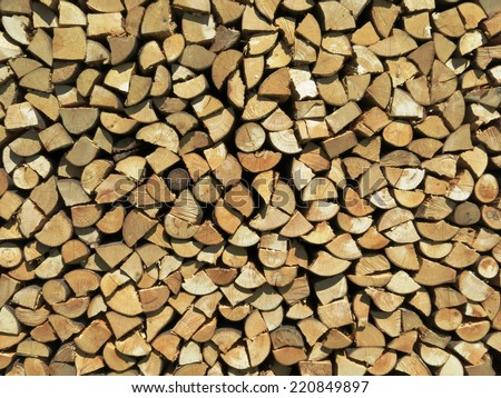 Woodpile kindling firewood wood winter lumber log background.