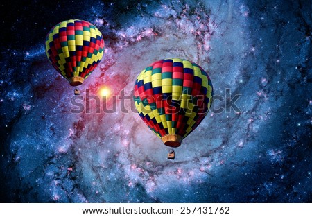 Hot air balloon surreal landscape magical fantasy galaxy. Elements of this image furnished by NASA.