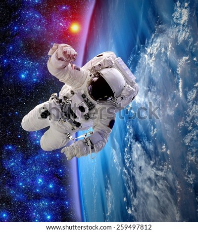 Astronaut spaceman outer space suit people floating earth. Elements of this image furnished by NASA.