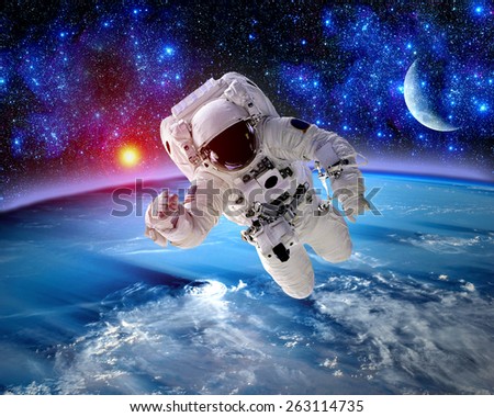 Astronaut spaceman outer space moon planet earth sun. Elements of this image furnished by NASA.