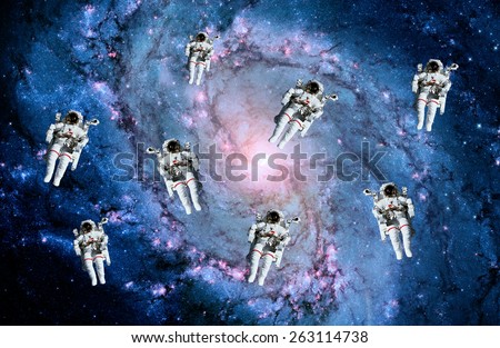 Astronauts spaceman suit galaxy spiral people space milky way. Elements of this image furnished by NASA.