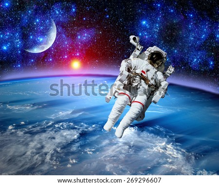 Astronaut spaceman space suit cosmonaut moon earth sun. Elements of this image furnished by NASA.