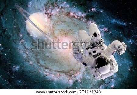 Astronaut spaceman black hole space suit galaxy spiral planet. Elements of this image furnished by NASA.