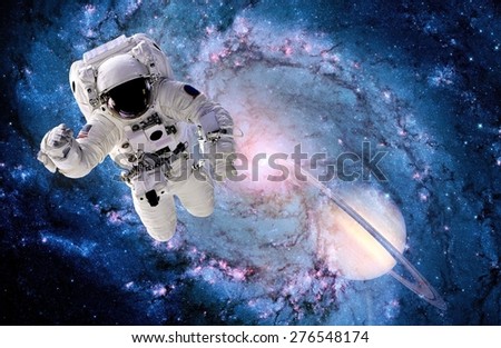 Astronaut spaceman outer space suit black hole galaxy. Elements of this image furnished by NASA.