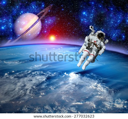 Astronaut spaceman outer space gravity planet earth sun. Elements of this image furnished by NASA.