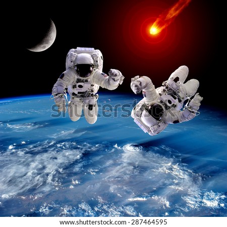 Astronaut spaceman Earth meteor asteroid meteorite moon. Elements of this image furnished by NASA.