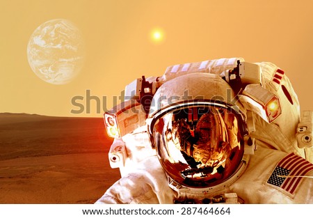 Astronaut spaceman helmet space planet Mars apocalypse Earth. Elements of this image furnished by NASA.