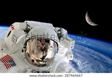 Astronaut spaceman isolated helmet space stunning earth moon. Elements of this image furnished by NASA.