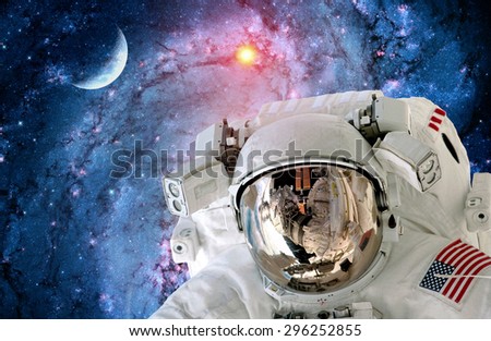 Astronaut spaceman helmet outer space scene universe galaxy moon. Elements of this image furnished by NASA.