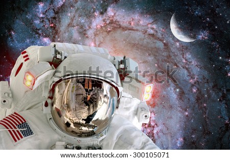 Astronaut spaceman helmet outer space station satellite galaxy moon. Elements of this image furnished by NASA.