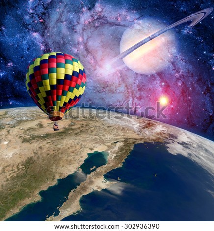 Hot air balloon surreal wonderland landscape fantasy moon earth. Elements of this image furnished by NASA.