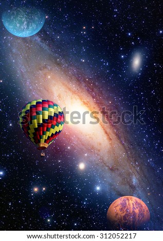 Hot air balloon surreal wonderland fairy tale landscape fantasy planets. Elements of this image furnished by NASA.