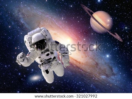 Astronaut spaceman suit outer space saturn planet people universe. Elements of this image furnished by NASA.
