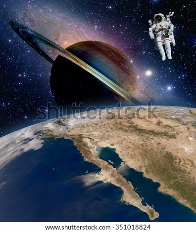 Astronaut spaceman saturn planet sci fi outer space walk suit spacewalk. Elements of this image furnished by NASA.