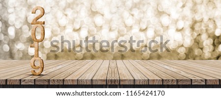 2019 happy new year wood number (3d rendering) on wood table with sparkling gold bokeh wall,leave space for banner display or montage of design or content