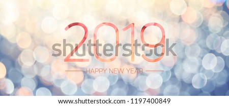 Happy new year 2019 banner with pale yellow and blue bokeh light sparkling background,Holiday greeting card