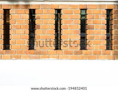 House brick wall with space between posts