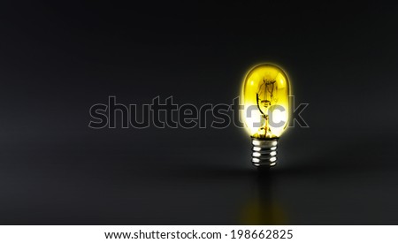 Shiny light bulb on black background,leave space for text content