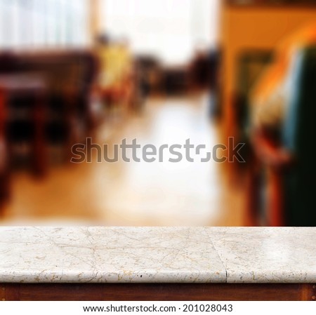 marble table and blur cafe place in background. product display template.