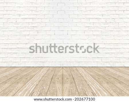 empty brick room wall and wood plank floor