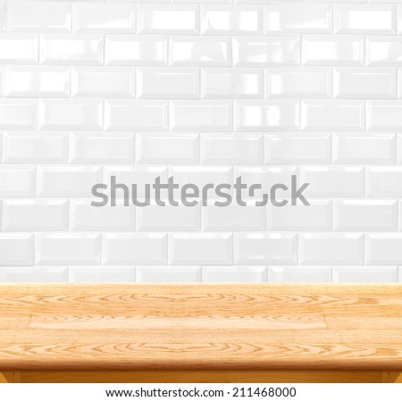Empty wood table and ceramic tile brick wall in background. product display template.