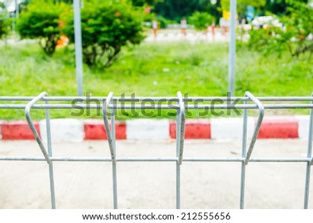 Wire fence at road and red line parking