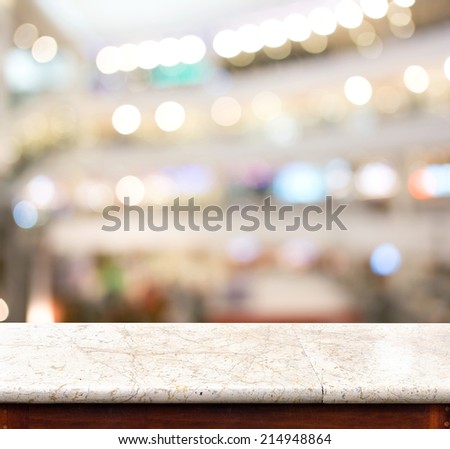 Empty marble table and blur store in background. product display template.