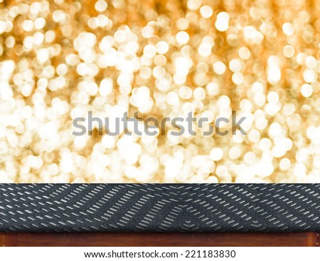 Zigzag fabric Table with bokeh golden sparkling background,Empty room for display your product