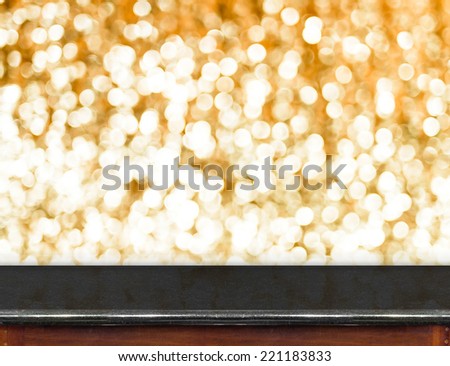 Black marble Table with bokeh golden sparkling background,Empty room for display your product