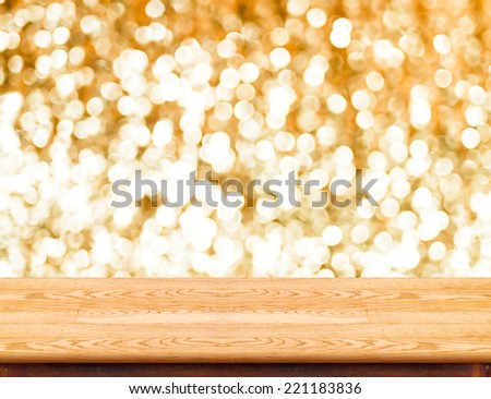 Wood Table with bokeh golden sparkling background,Empty room for display your product