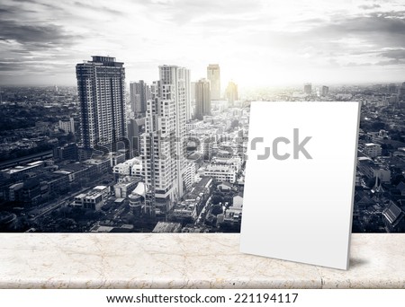 Paper poster with Landscape View of City Skyline Buildings from High Rise marble balcony with sun burst behind the building- Template mock up for display your product and add your content