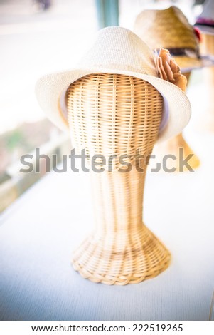 Vintage filter : lady hat on a wickerwork mannequin head