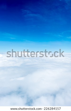 Blue sky and Cloud Top view from airplane window,Nature background